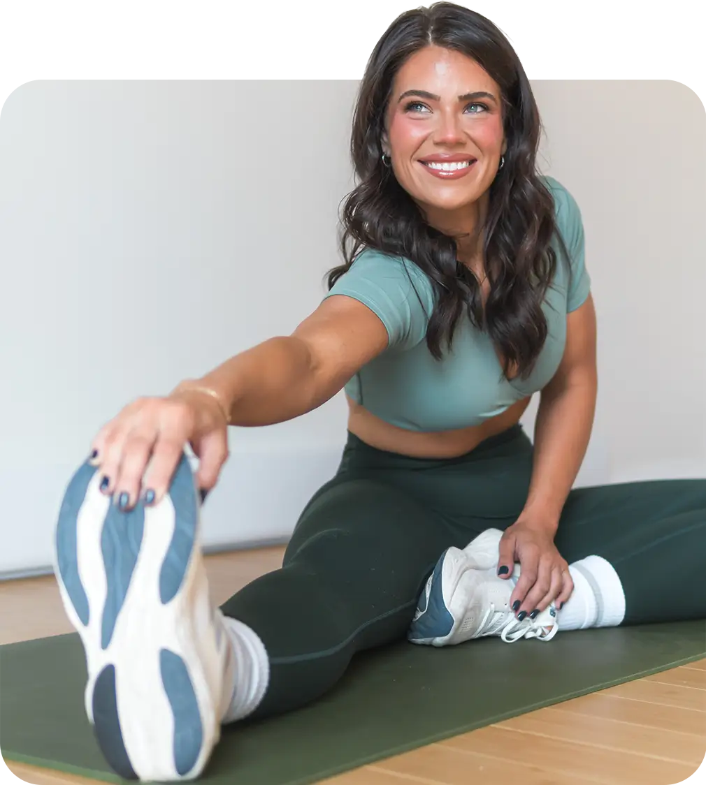 Lea Jennings on a yoga mat doing stretches